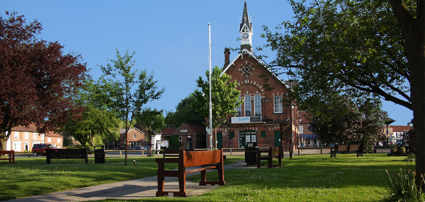 Easingwold town square with historic buildings and village green
